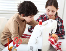 Kids using sewing machine