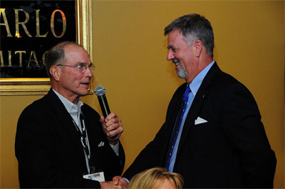 2011 Multi-Unit Franchising Conference Chairman Charles Smithgall, left, Congratulates 2012 Chairman John Metz